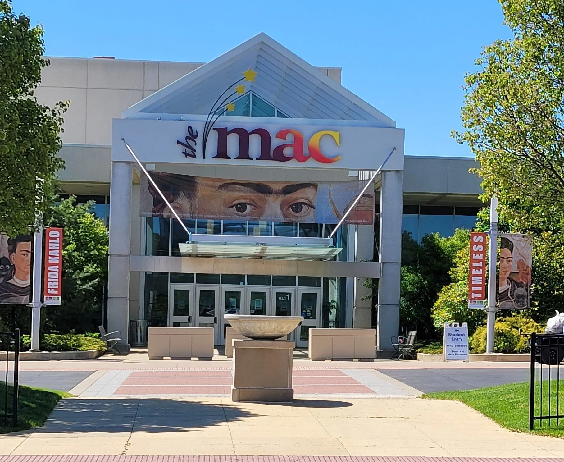 Custom banners made to hang under the MAC marque, and flank the main entrance on light poles.