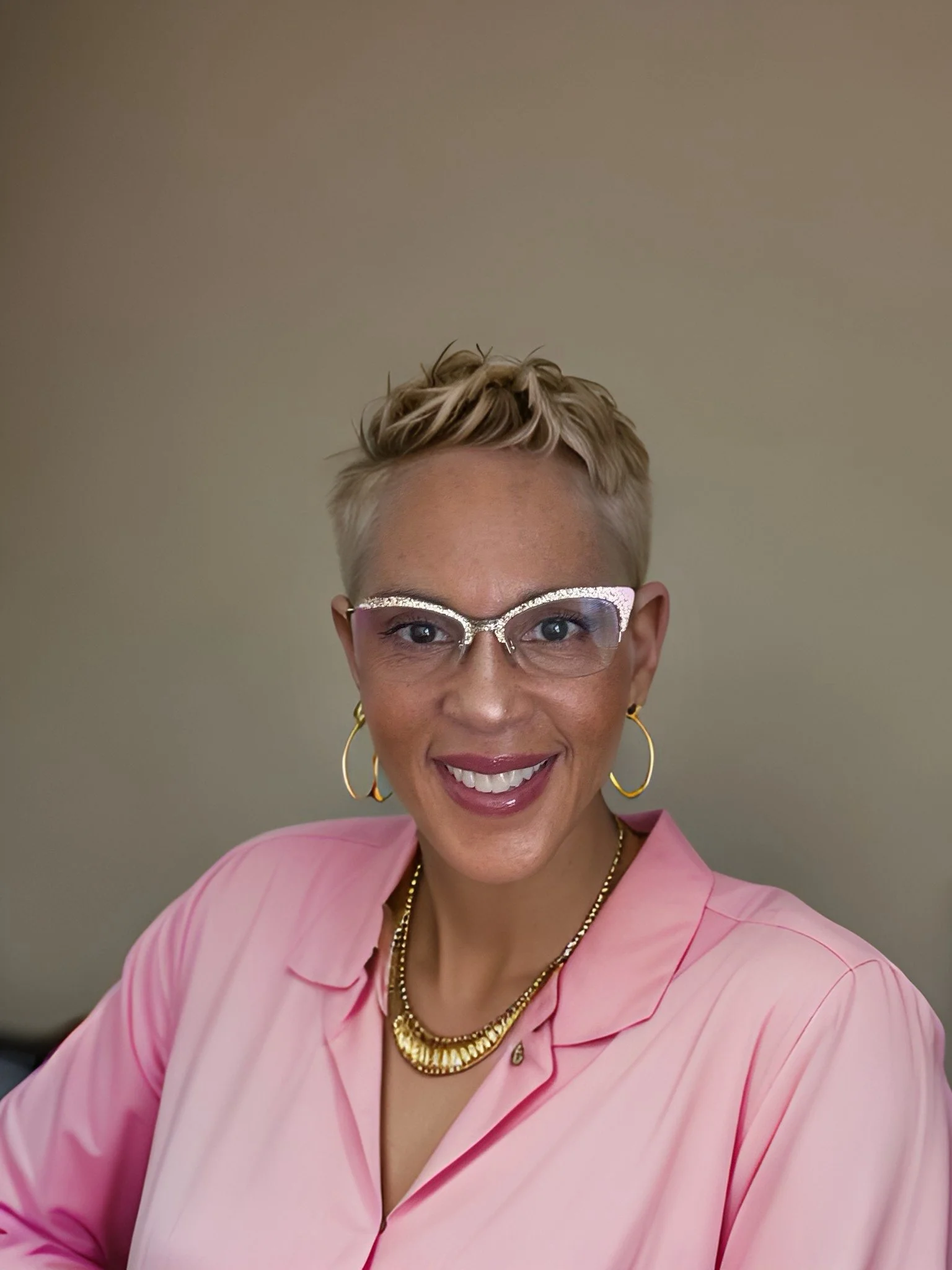 Dr. Chanin Hardwick, founder of Embodied Soul Psychotherapy™, warmly smiling in a calm, light-filled setting—embodying presence, compassion, and grounded expertise in trauma-informed care.