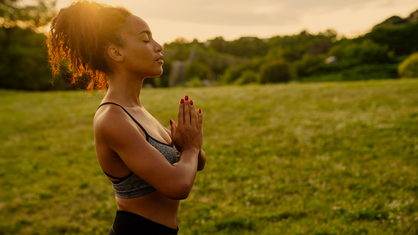 A person in quiet seated yoga practice, symbolizing the embodied self-inquiry and nervous system integration at the heart of yoga therapy for trauma healing