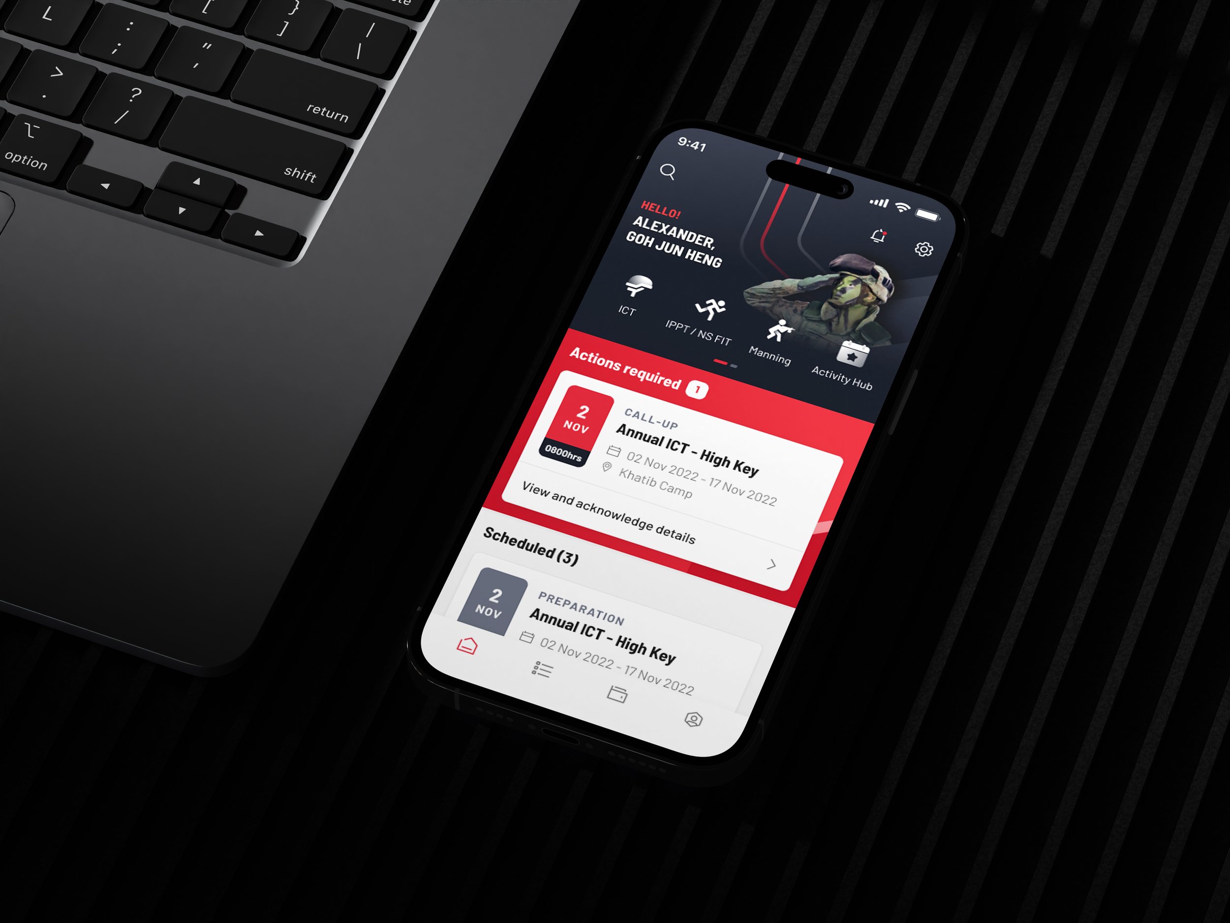 Smartphone displaying a flight information app next to a laptop on a black textured surface.