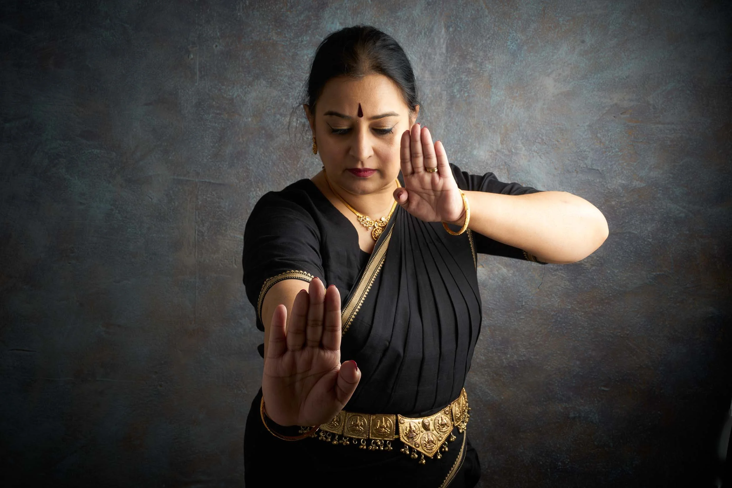 satyam-dance-bharatanatyam-black-costume-palms-forward.jpg