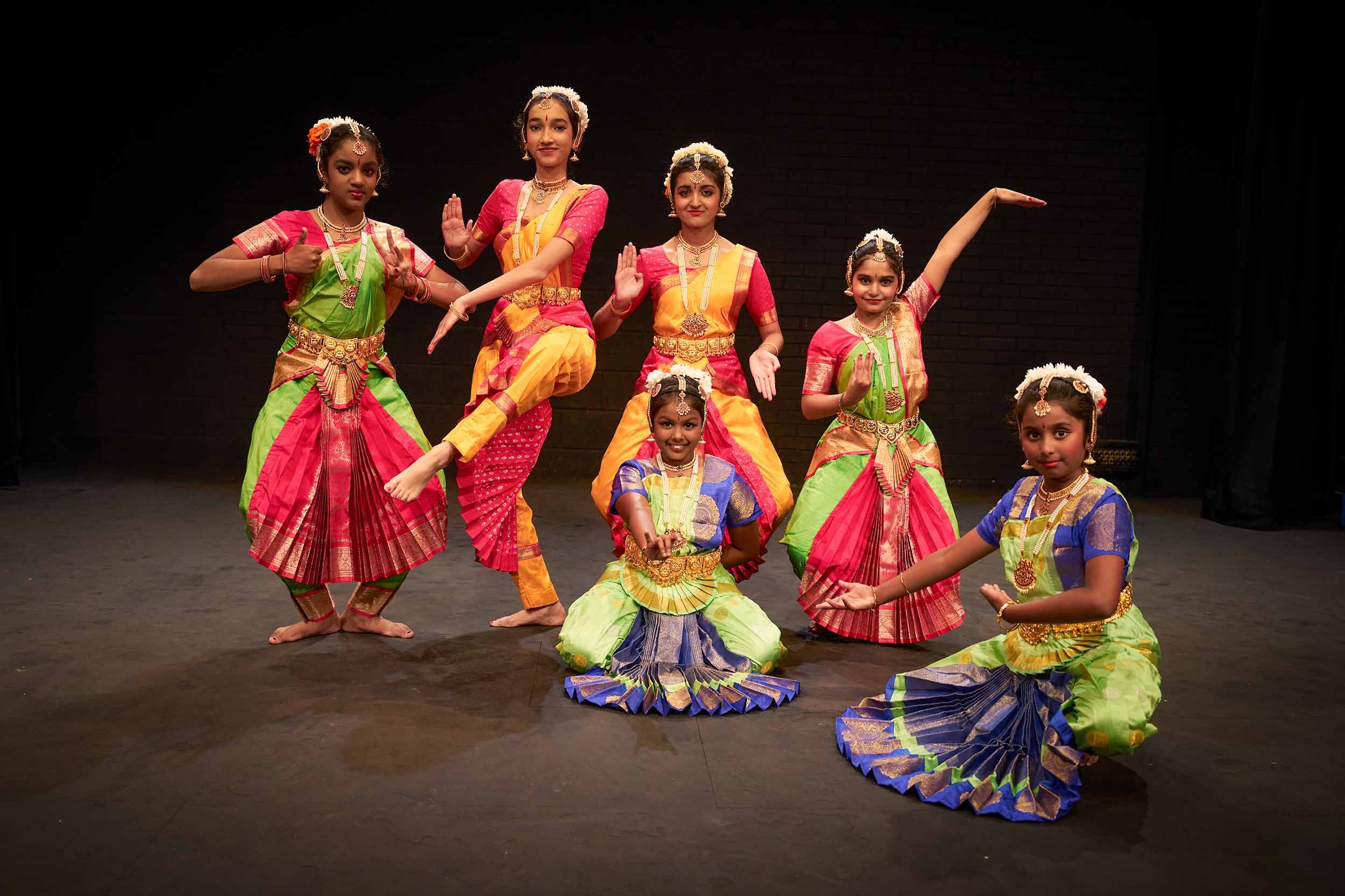 satyam-dance-students-bharatanatyam-group-leg-lift-stage.jpg