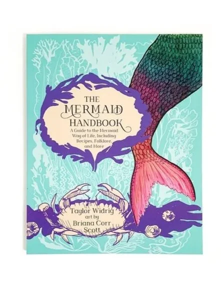 Book cover titled "The Mermaid Handbook" with a mermaid tail and illustrations of crabs and sea creatures, in a whimsical, colorful style.