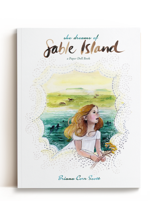 Cover of a paper doll book titled 'She Dreams of Sable Island' by Briana Corr Scott, featuring an illustrated girl with red hair holding yellow flowers, with a scenic background of green hills, water, and horses.