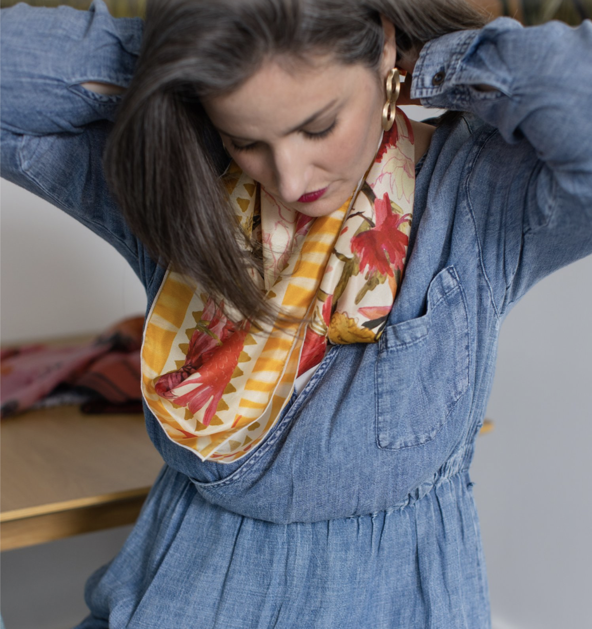 Square silk scarf with bright pink and red floral illustration on a soft background, designed by Briana Corr Scott and printed in Montreal, Canada.