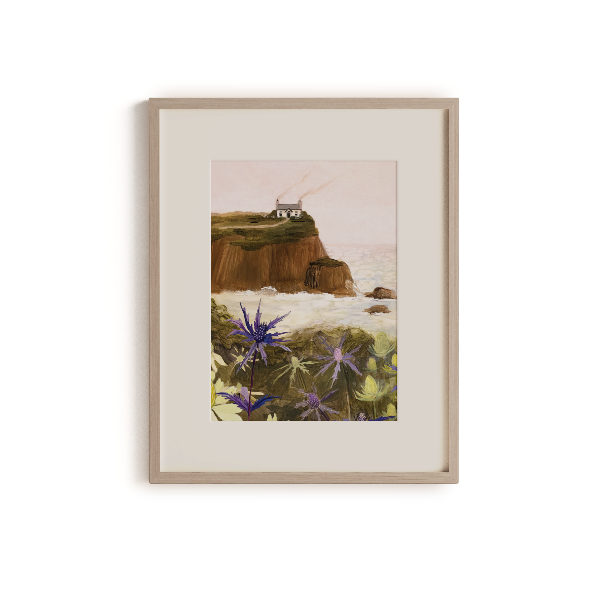 Gouache painting of a coastal cliff with a white house, sea holly flowers in the foreground, and waves crashing below – artwork by Briana Corr Scott