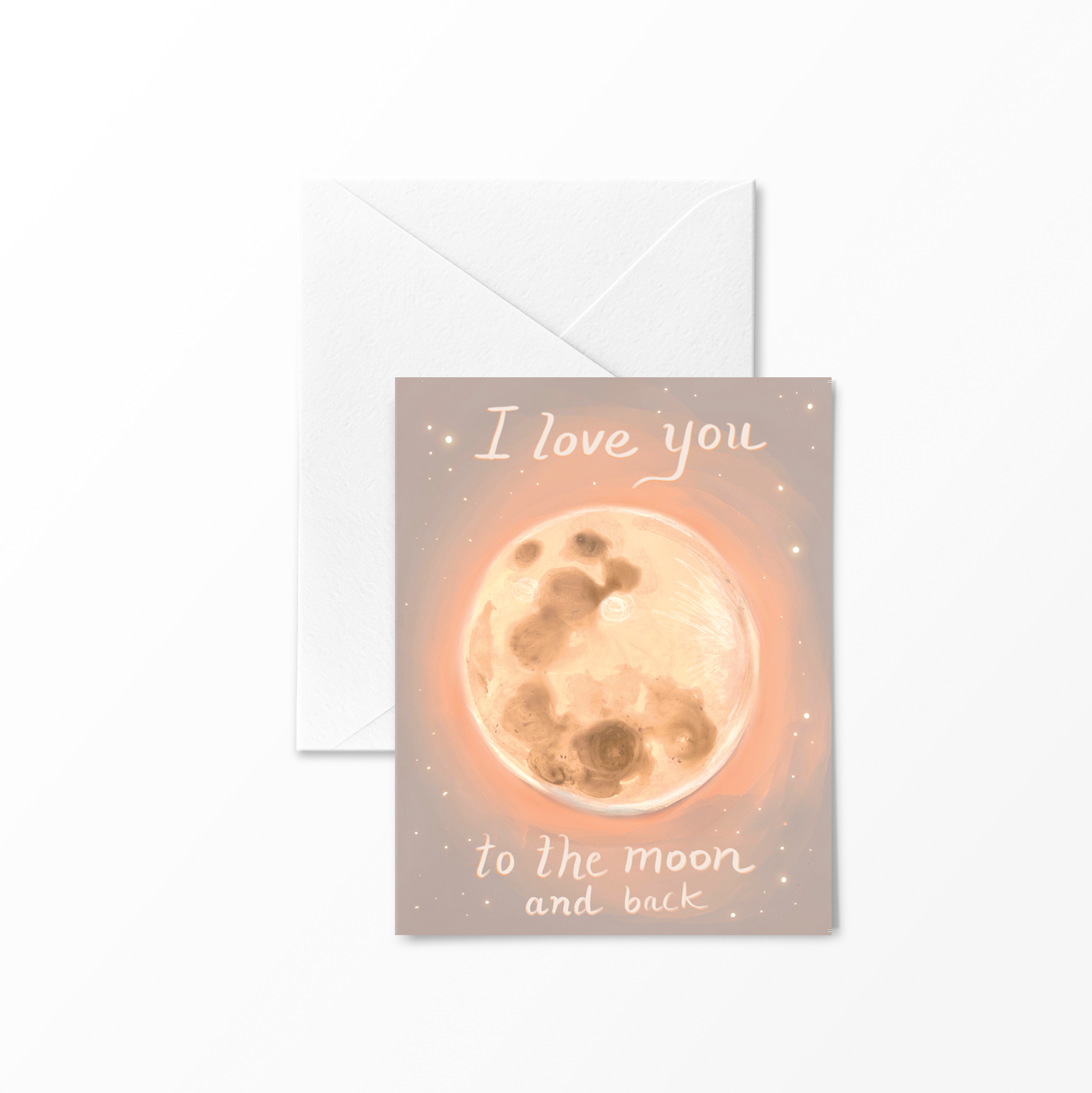 Hand holding a greeting card illustrated with a glowing full moon and the phrase “I love you to the moon and back” – artwork by Briana Corr Scott