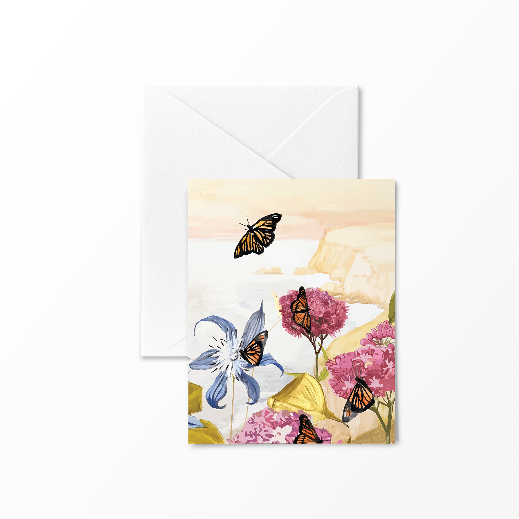 Greeting card featuring several monarch butterflies fluttering around milkweed and wild coastal flowers, with pink cliffs and a soft pastel sky in the background.