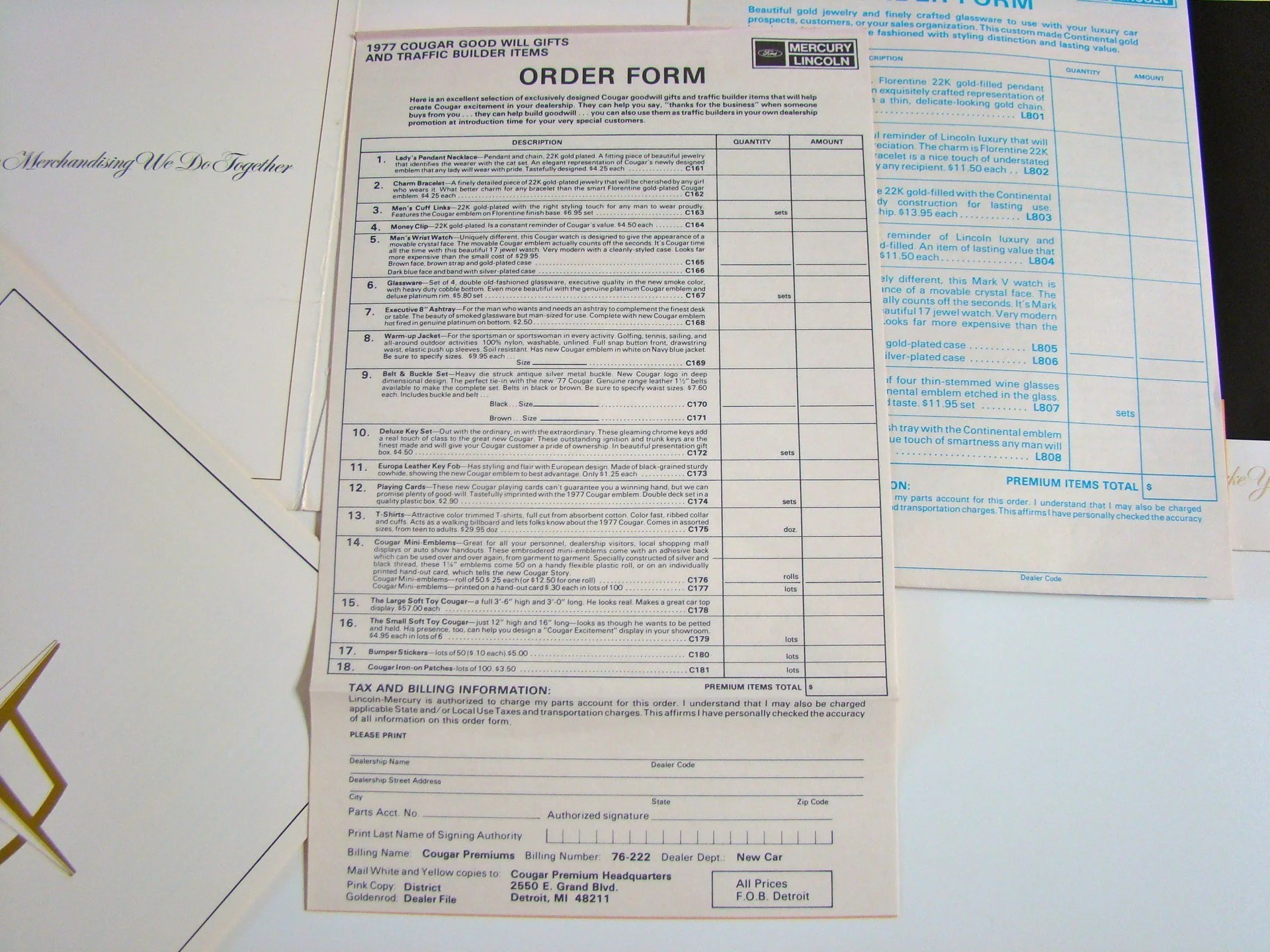Order form for 1977 Cougar Good Will Gifts and Traffic Builder Items, listing various car-related accessories and memorabilia including jewelry, watches, clothing, and collectible items, with sections for quantities, prices, and billing information.