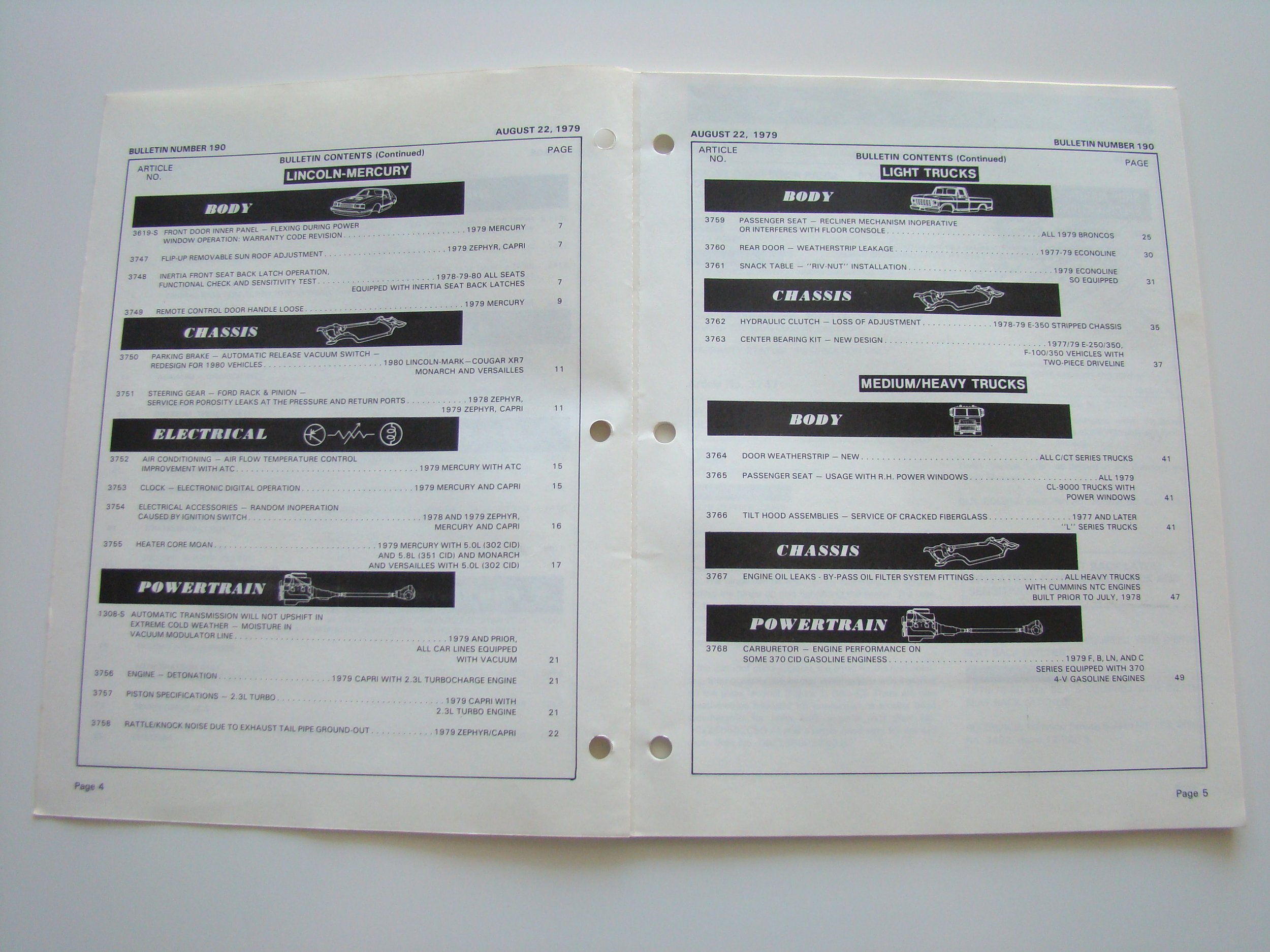 Open vintage car service manual showing sections on Lincoln-Mercury and light trucks from August 22, 1979.