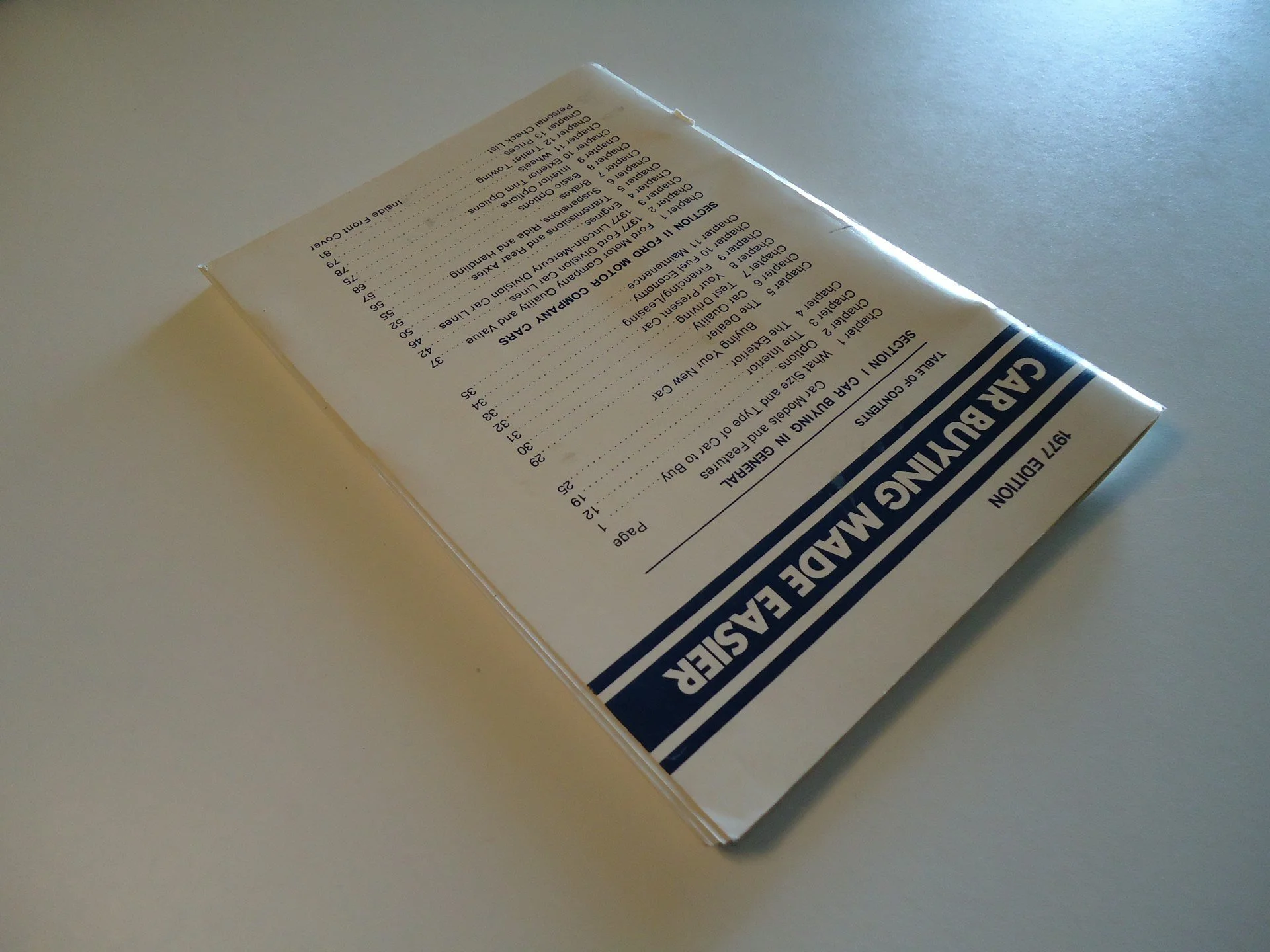 Packet of dry seasoning mix or food product with text and a blue stripe, placed on a white surface.