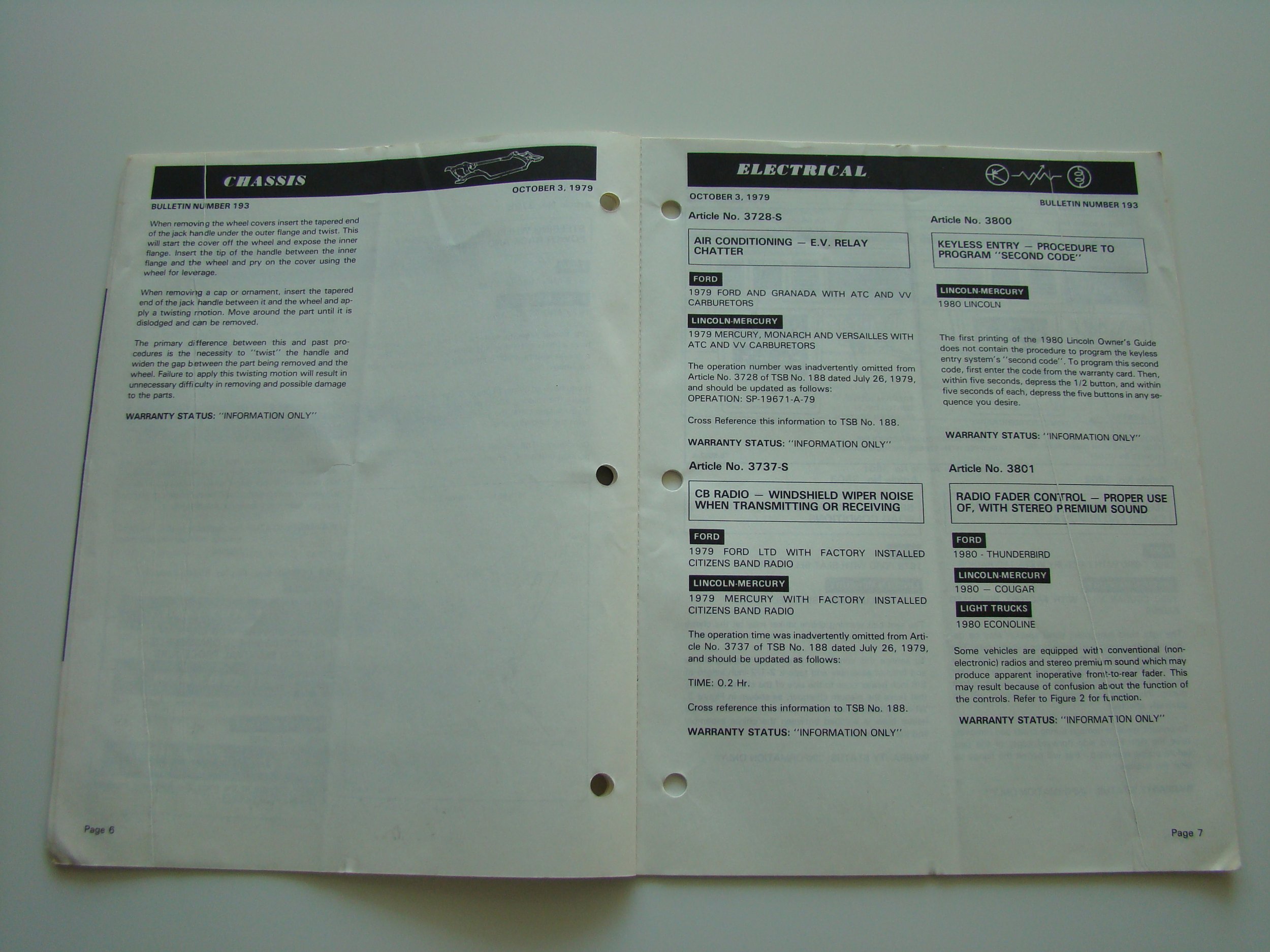 Open car service manual with pages on chassis and electrical systems, including information on wheel covers, horn, air conditioning relay, keyless entry, radio fader control, and vehicle models from 1979 and 1980.