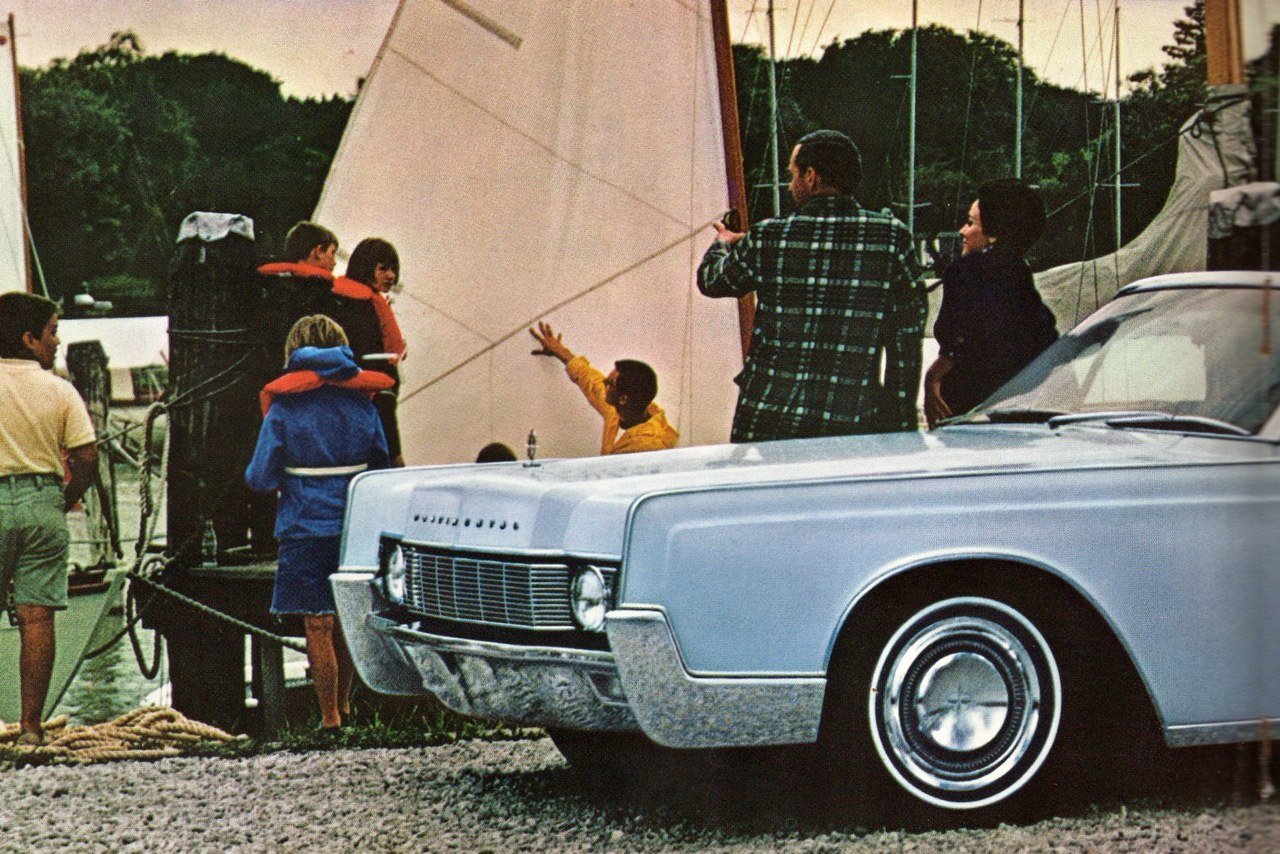 A vintage scene with a vintage light blue car parked near a dock, and a group of people aboard a boat with a large cream-colored sail. Some people are wearing life jackets, and others are standing or sitting on the dock, possibly preparing for a boat