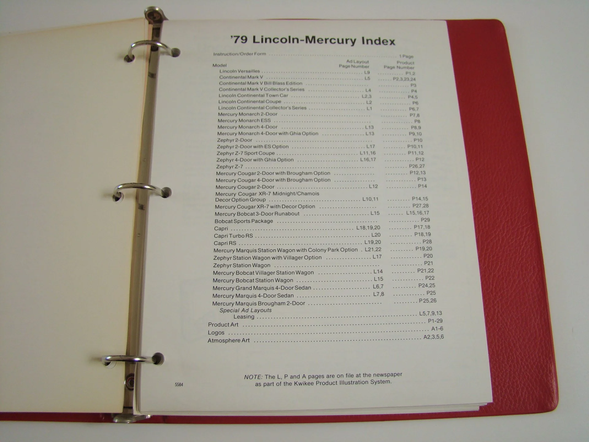 The image shows a binder with a printed list of car models and specifications for 1979 Lincoln-Mercury vehicles, titled '’79 Lincoln-Mercury Index.'
