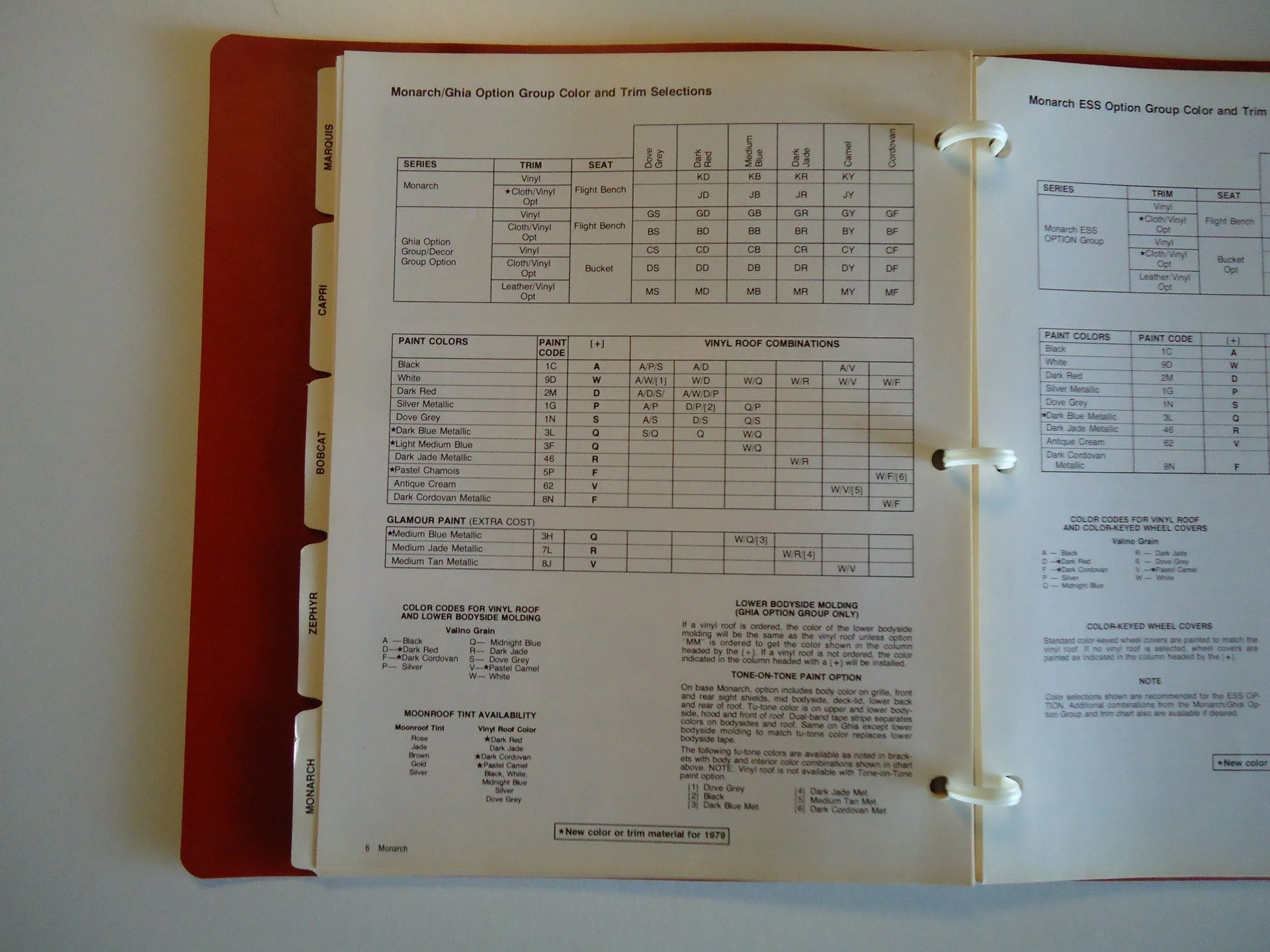 Open manual page showing color and trim options for Monarch and Ghia models, including paint colors, vinyl roof combinations, and body molding details.
