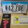 Close-up of a vehicle license plate with the characters '042 ZBE', registered in Iowa.