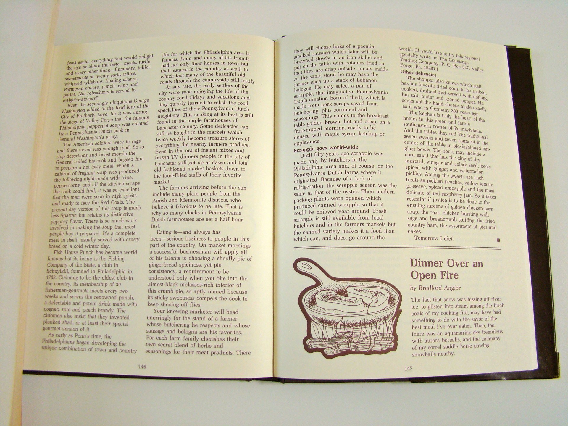 Open book showing two pages of text and a small illustration of a cooking pot with a dish inside.