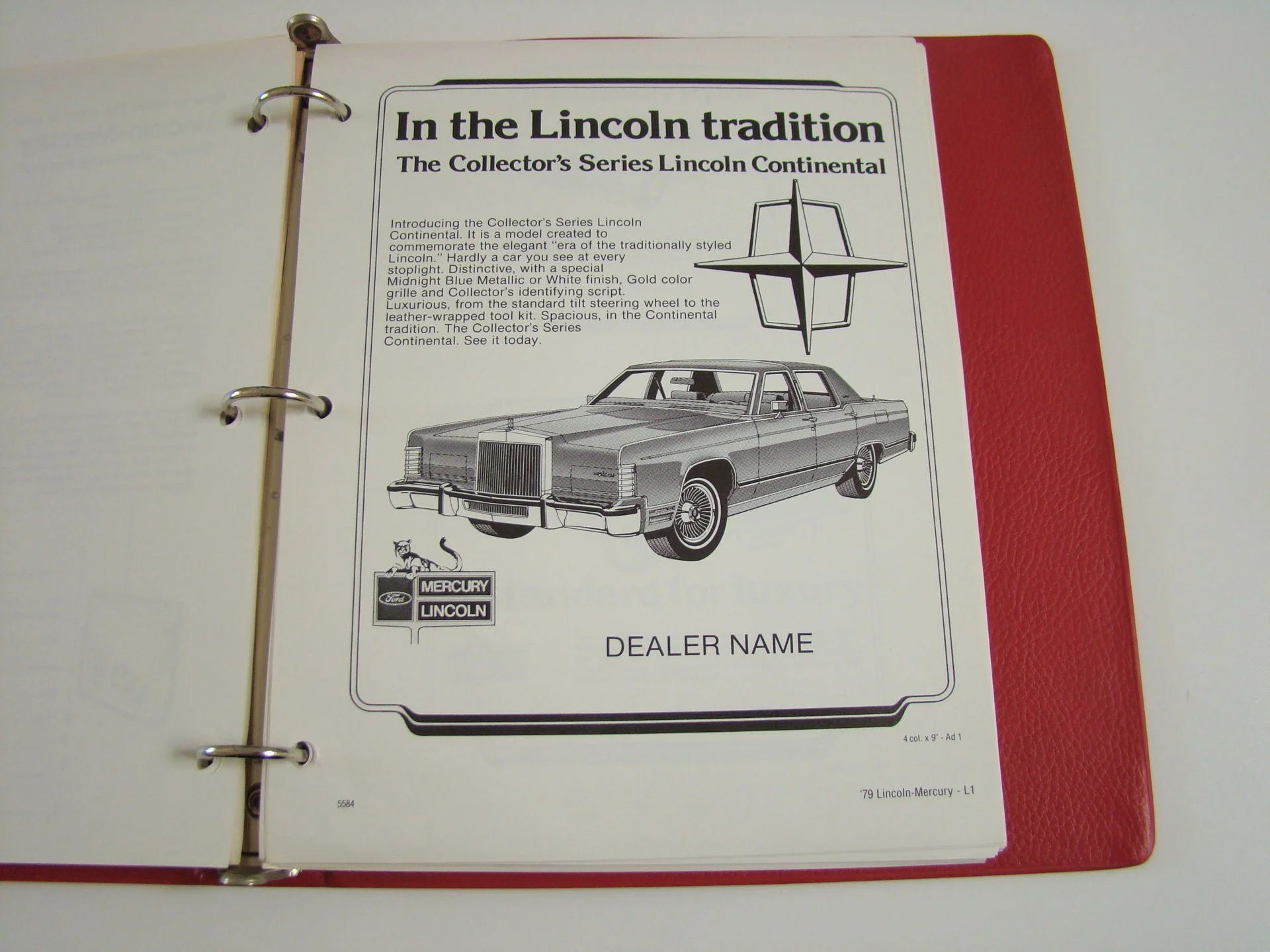 A binder page displays promotional material for the Lincoln Continental car, with an illustration of the car, Lincoln logo, Mercury Lincoln emblem, and placeholder for a dealer name.