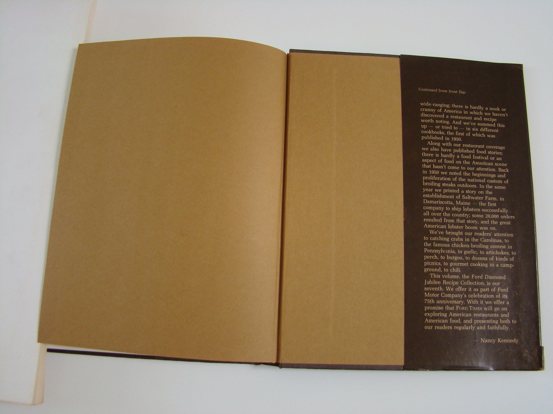 Open book with brown pages and printed text on the right page, blank on the left page.