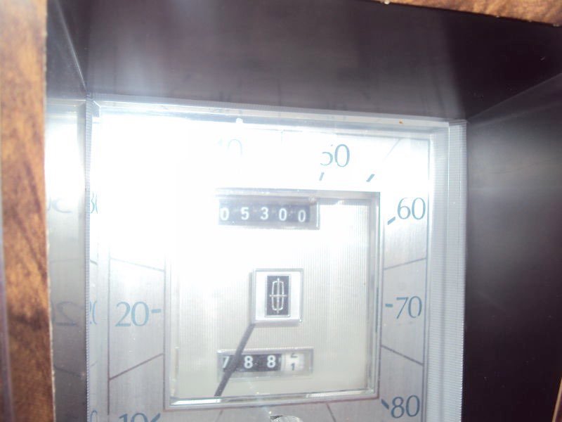 Close-up of a vintage gas pump display showing 53 dollars and 8.81 gallons, with a price per gallon of 0.53.