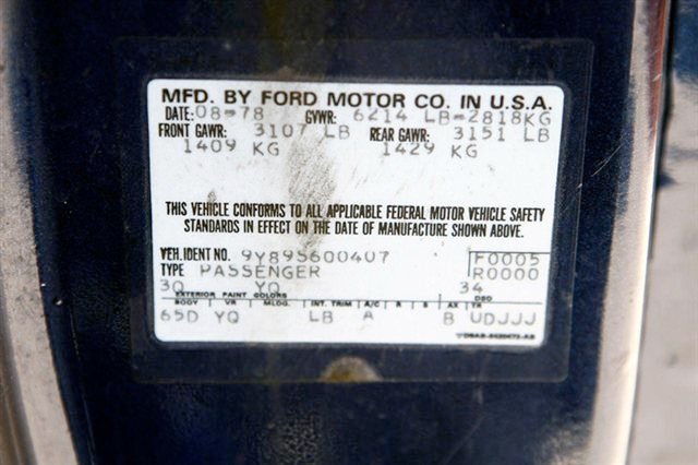 Vehicle identification and manufacturing information label showing Ford Motor Company, production date August 1978, vehicle type as passenger, with weight and safety standard details.