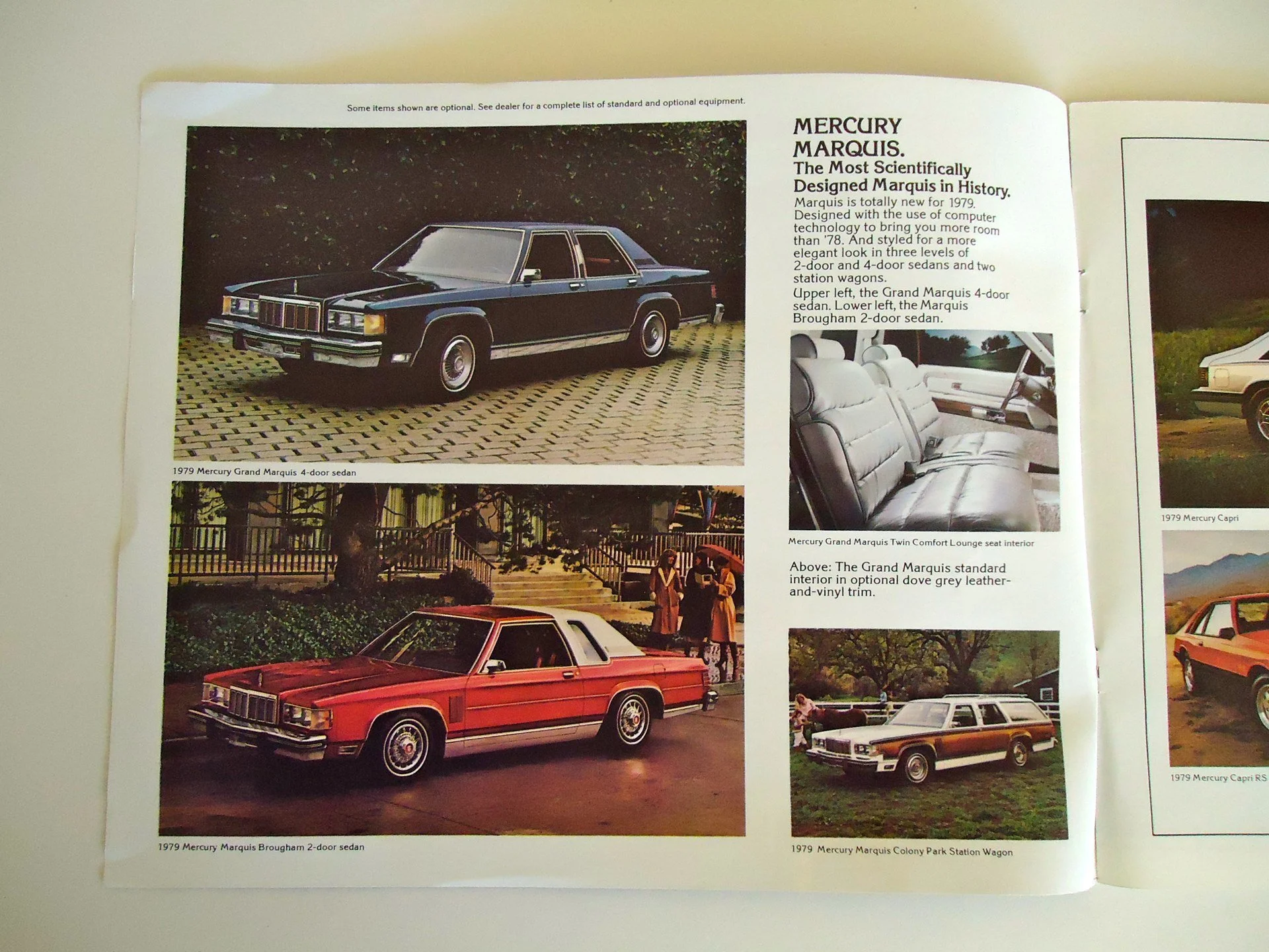 Photograph of a printed magazine page featuring vintage cars, including a black 1979 Mercury Grand Marquis 4-door sedan at the top, a red 1979 Mercury Marquis Brougham 2-door sedan below it, and a white Mercury Colony Park station wagon at the bottom