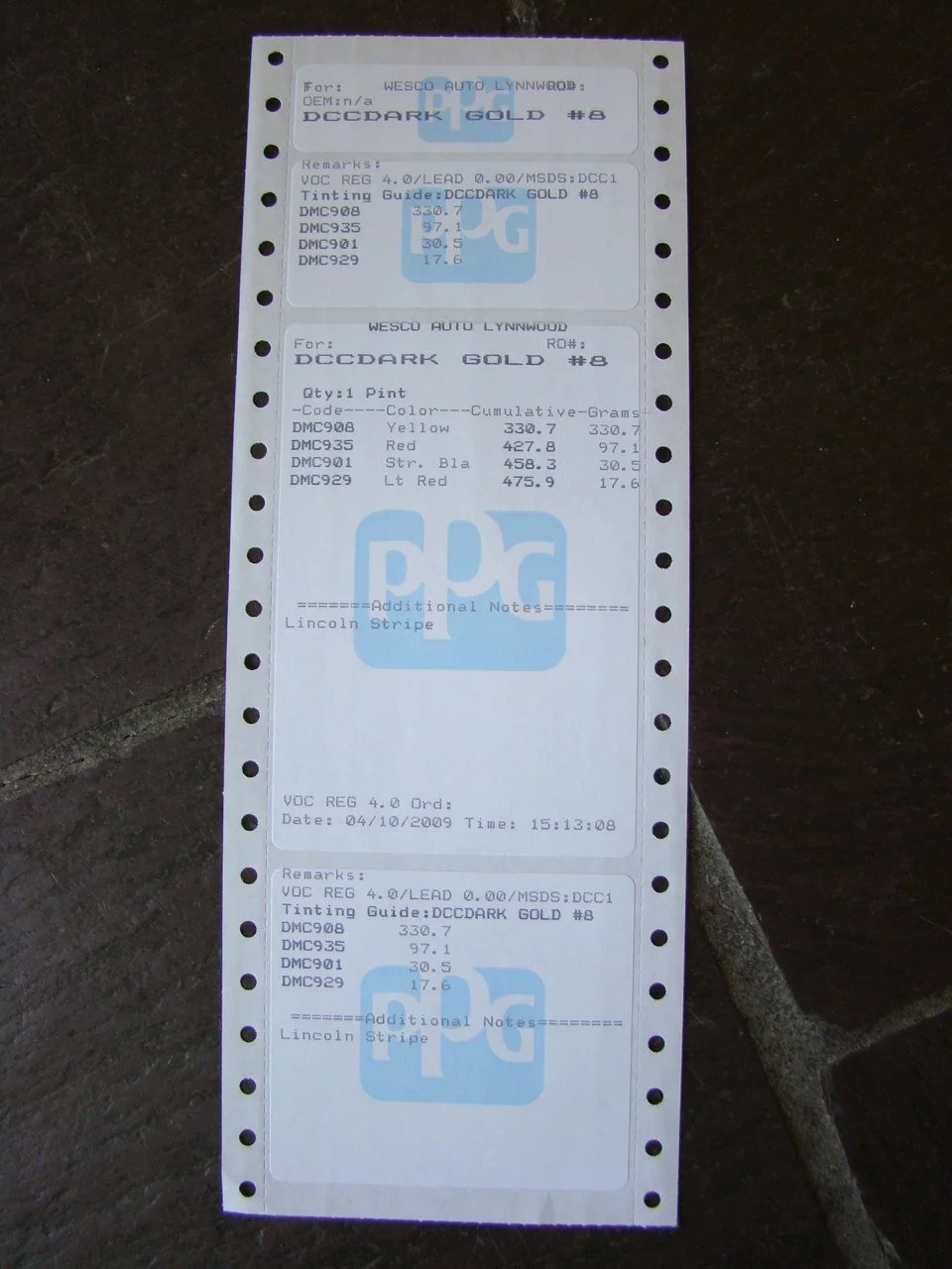 Receipt from Wesco Auto Lynnwood for DCCDark Gold #8, printed on a roll of paper, with various color and grams details, and additional notes about Lincoln Stripe.