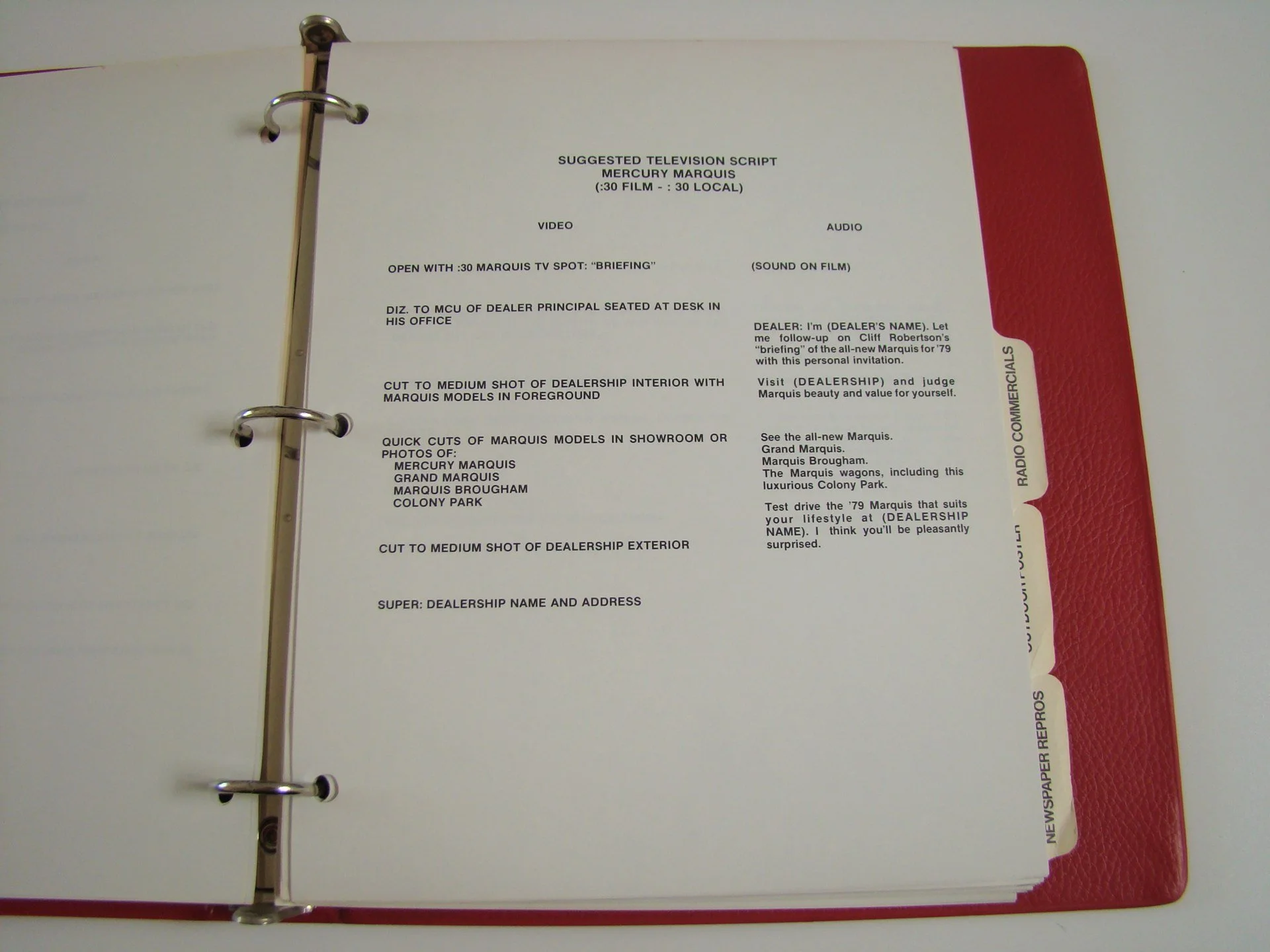 Page from a binder containing a suggested television script for Mercury Marquis, with tabs labeled for different sections such as radio commercials, newspaper reports, and more.