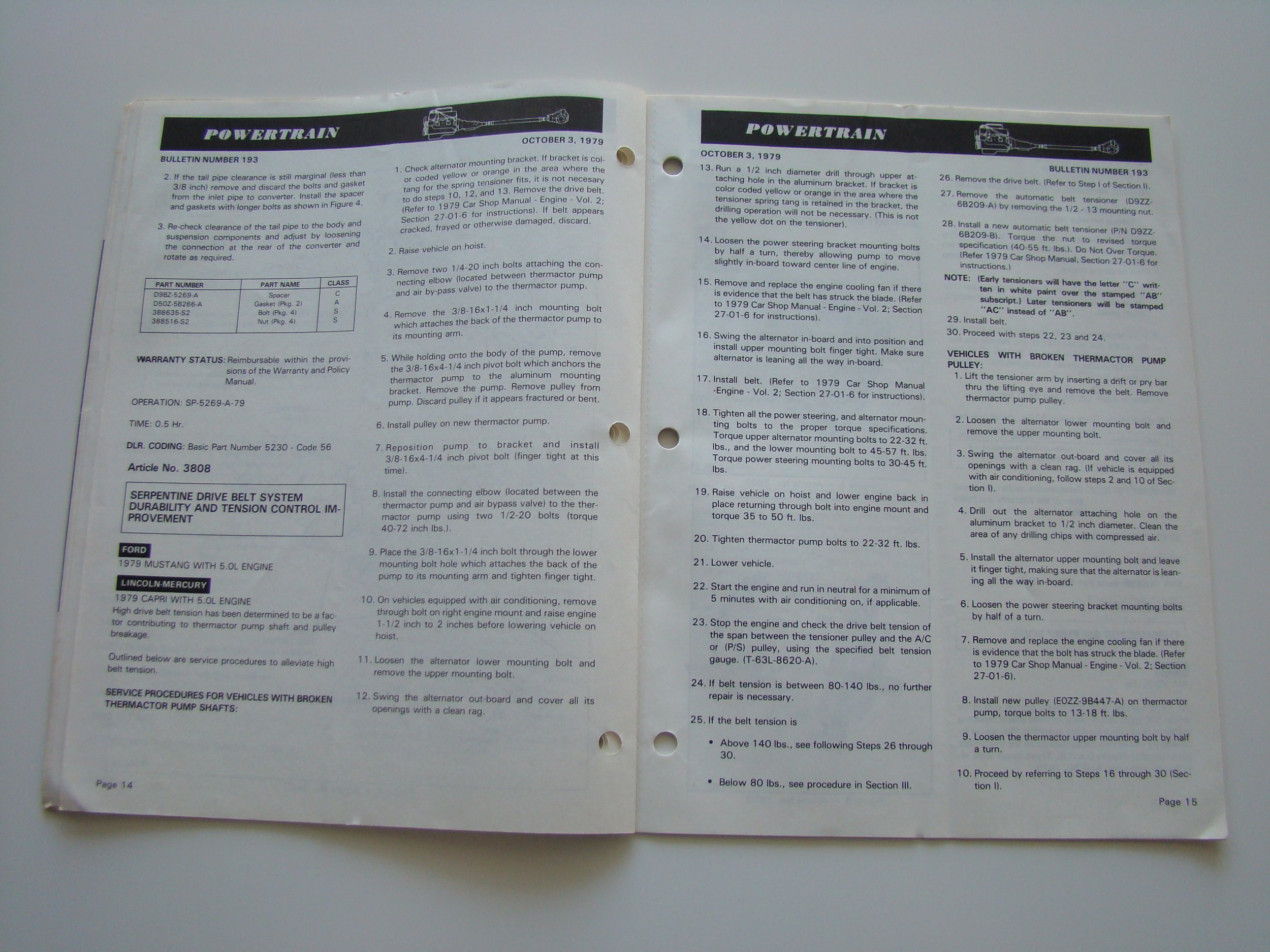 Open booklet with titles 'Powertrain' and 'Durability and Tension Control Improvement' from October 3, 1979, including procedures for inspecting and repairing a vehicle's powertrain, radiator, engine, and thermostat pump with various steps and specif