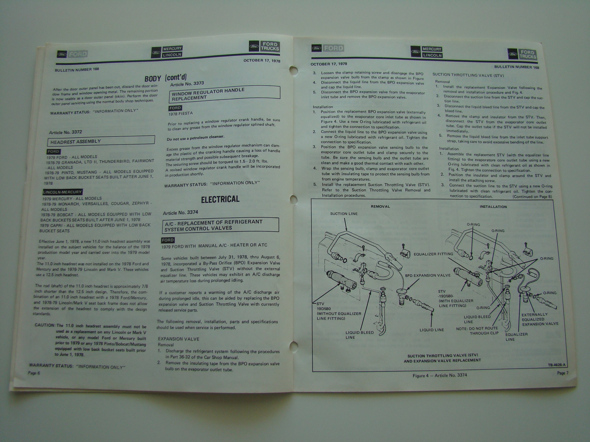Open car repair manual with instructions and diagrams for Ford vehicles, including electrical and engine components.