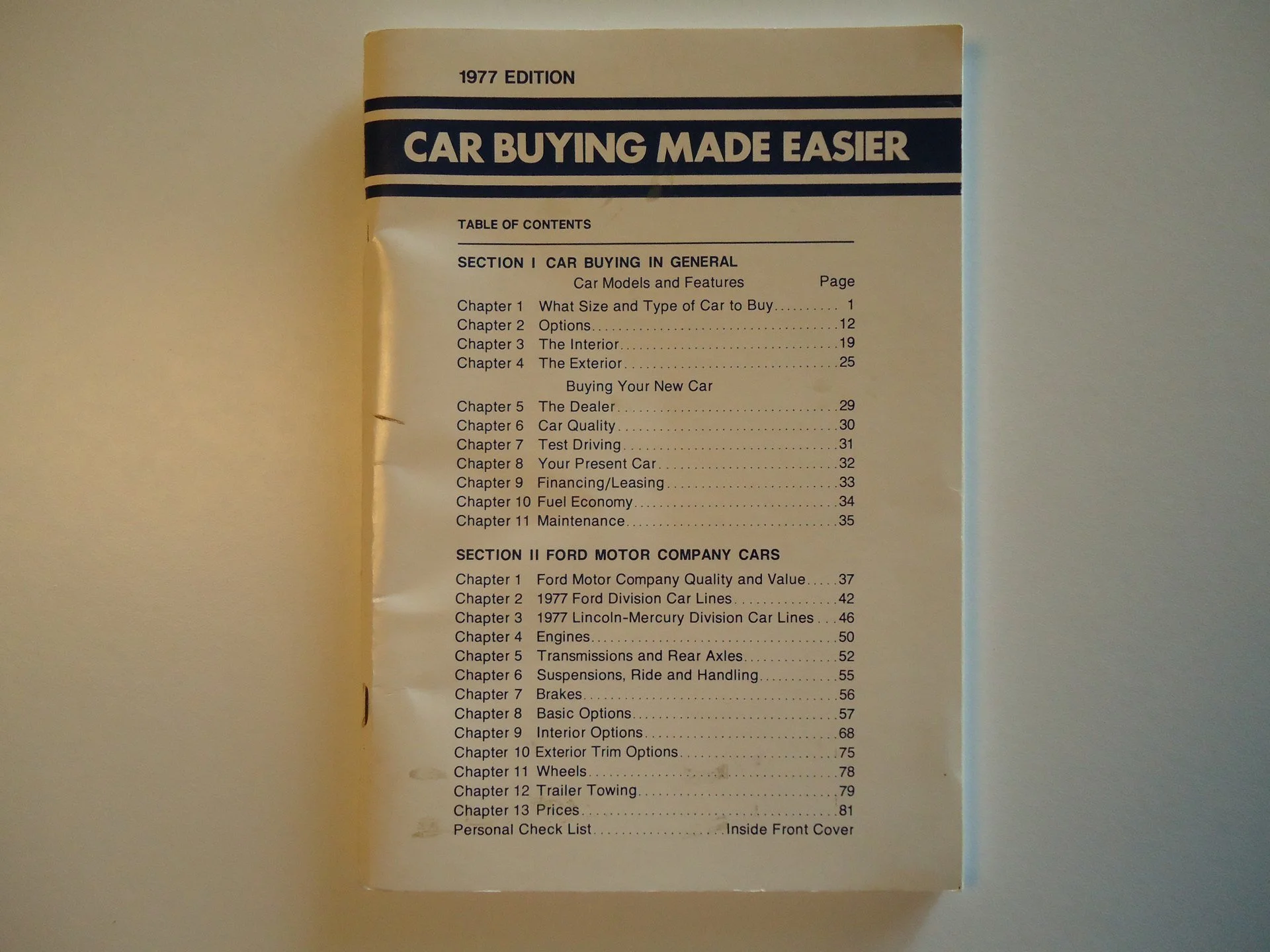 Table of contents from a 1977 edition car manual, listing chapters on car buying, Ford motor company cars, and related topics.