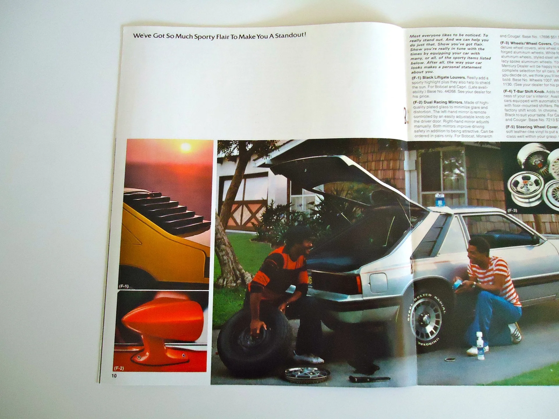 People working on a silver sports car with its trunk open in a driveway; one person is sitting on a tire, and another is sitting nearby holding a bottle, with various car parts shown in the magazine collage.