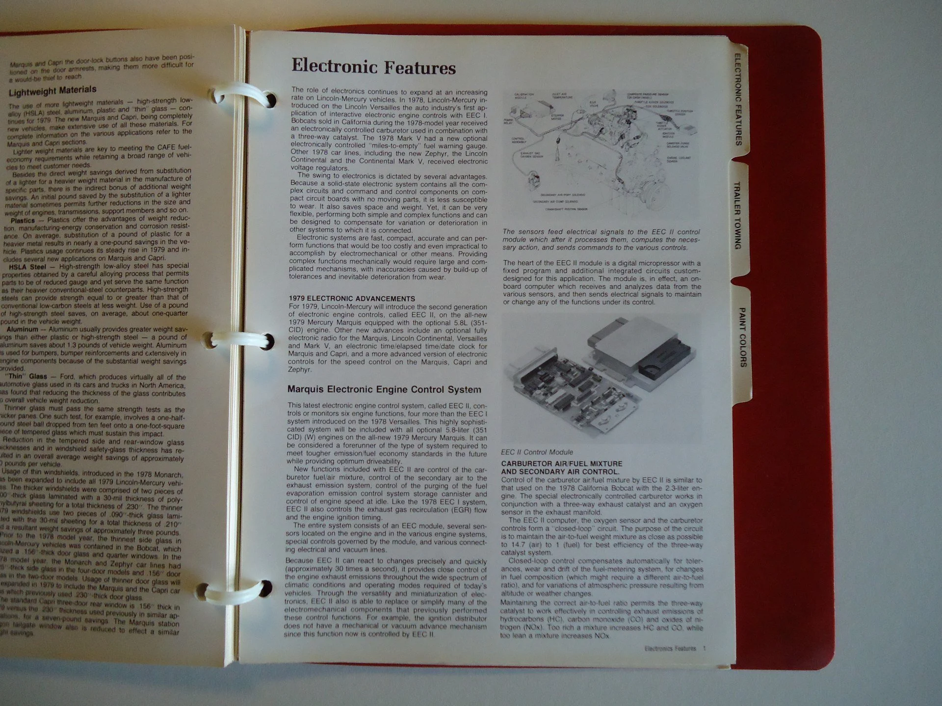 Open manual page titled Electronic Features with text about automotive electronic systems, diagrams of control modules, and sensor feed signals.