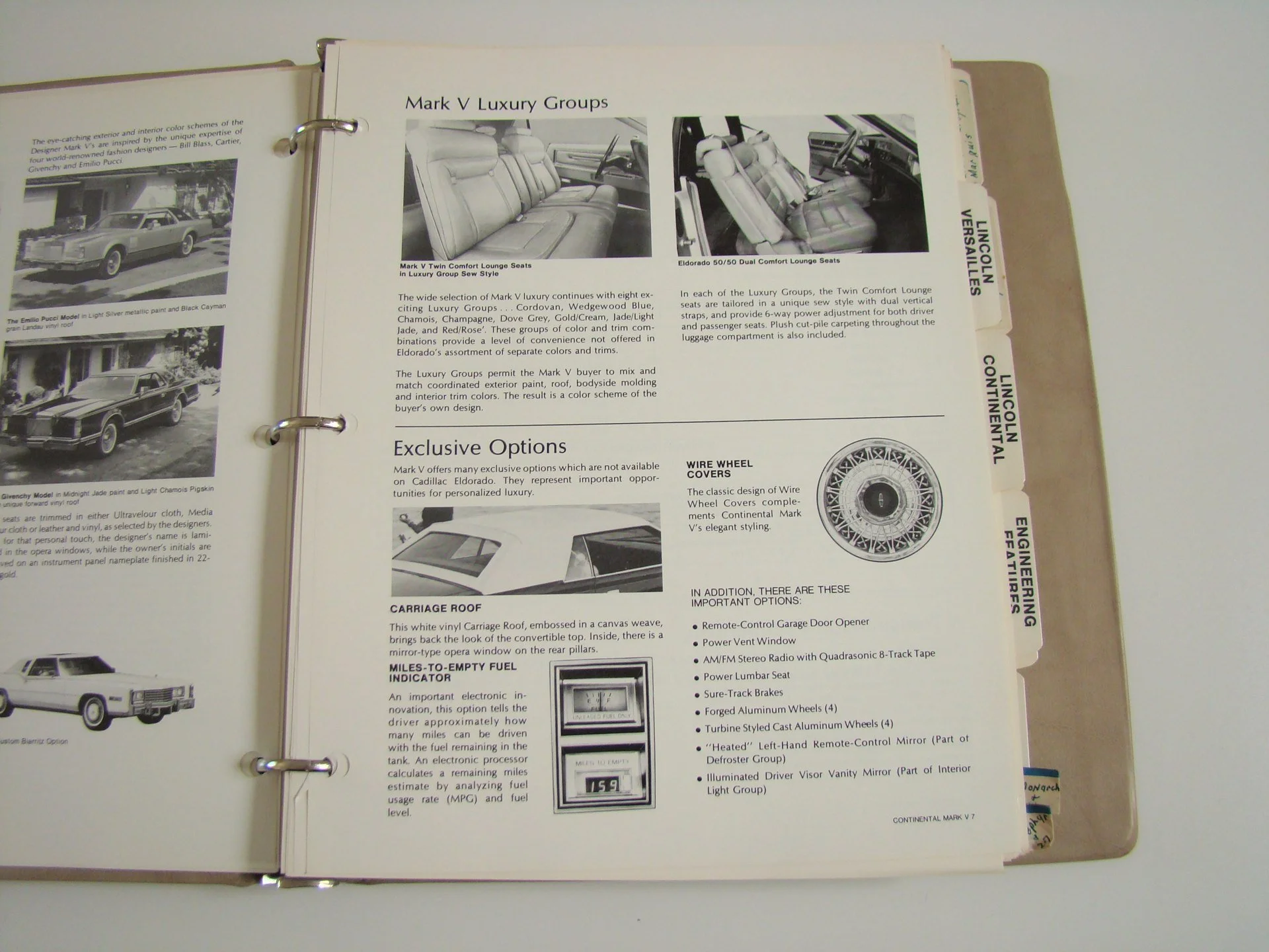 Open car brochure with black and white photos of luxury car interiors and options, displaying pages about Lincoln luxury groups and exclusive features.