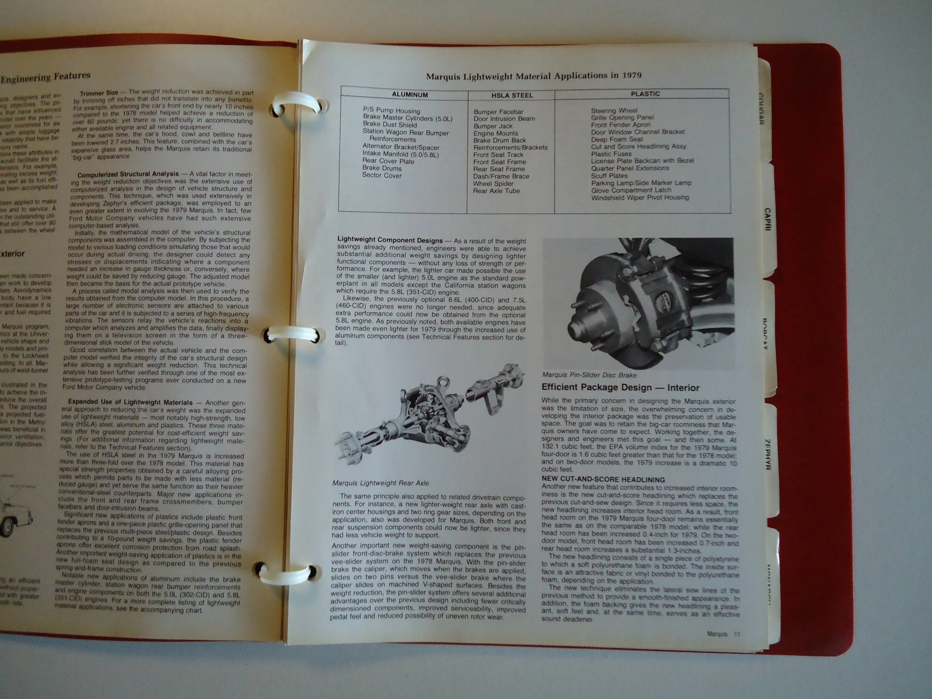 Open car manual showing sections on lightweight material applications, component designs, and features such as a dashboard, rear axle, and brake system.