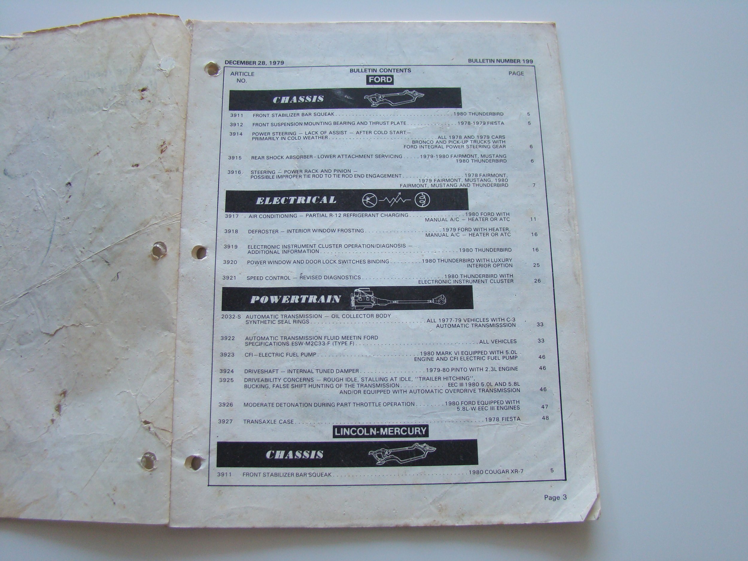 A page from a car parts catalog showing sections on chassis, electrical, and powertrain for Ford and Lincoln-Mercury vehicles, dated December 28, 1979.