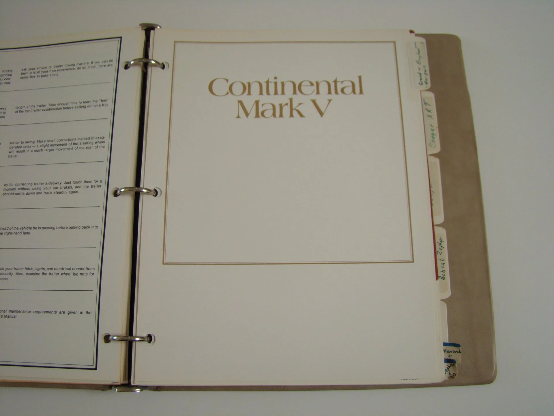 Open binder with a folder labeled 'Continental Mark V' and tabbed sections on the right.
