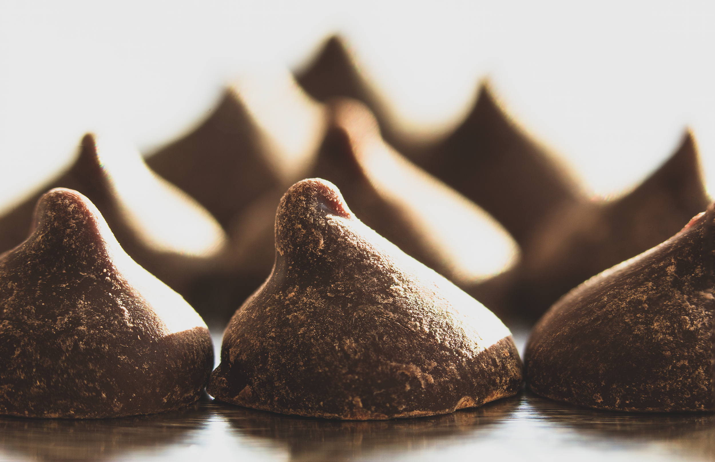 Close-up of semisweet chocolate chips with pointed tops.