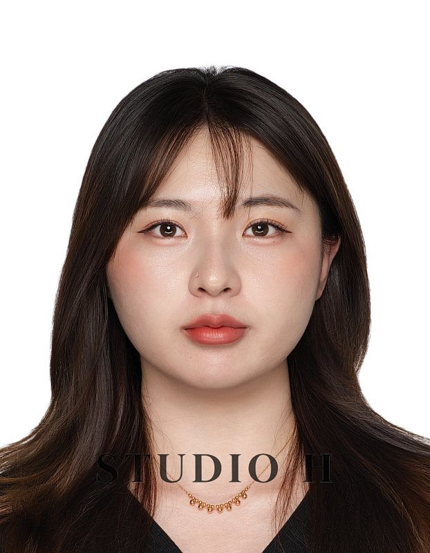 Portrait of a young woman with dark brown hair and a gold necklace, facing forward, against a white background, with the words 'STUDIO H' at the bottom.