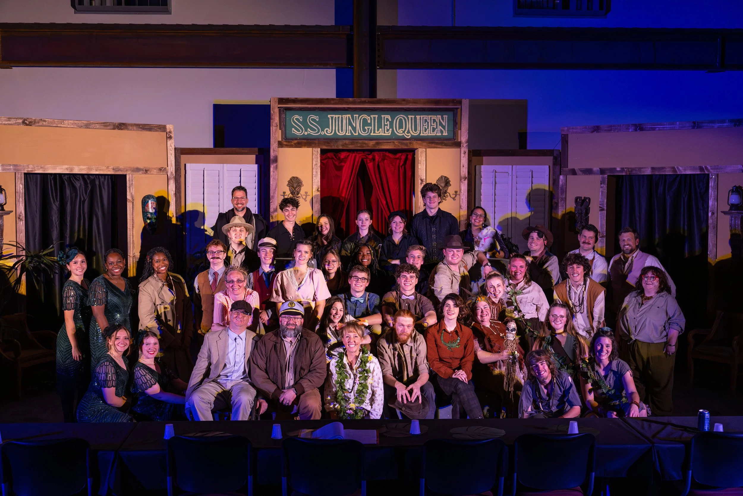 The full cast of Murder Aboard the S.S. Jungle Queen in their 1920s costumes on stage during a Broadway Maricopa community theater dress rehearsal in Maricopa, Arizona.