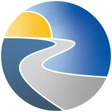 A circular logo featuring a winding road leading toward a sun setting or rising over a body of water.