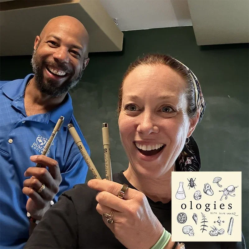 A woman and a man holding pens and smiling at the camera, with a logo and illustrations of insects and scientific equipment in the corner.