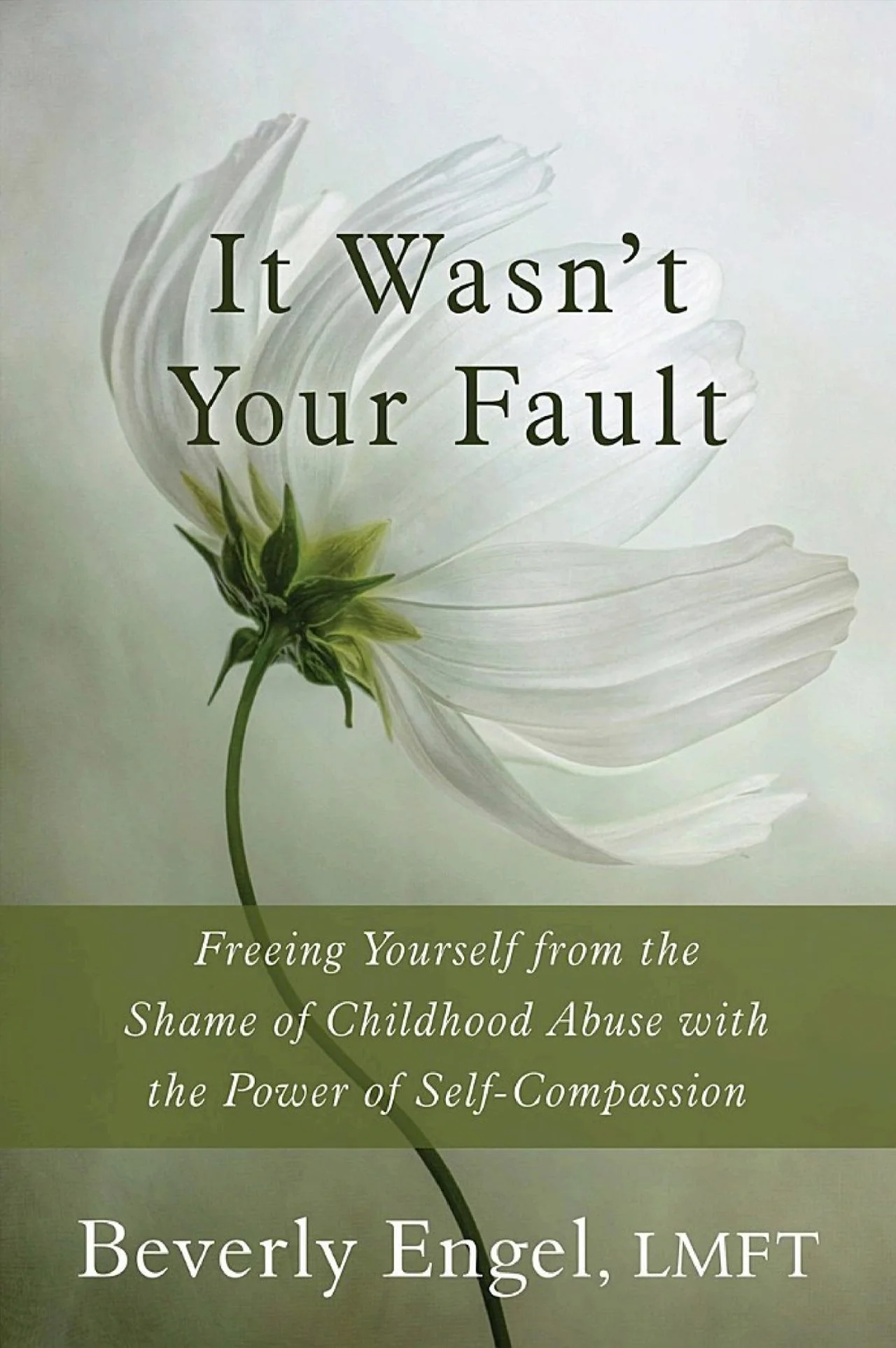 Book cover titled 'It Wasn't Your Fault' by Beverly Engel, LMFT, with a white flower on a light background and subtitle 'Freeing Yourself from the Shame of Childhood Abuse with the Power of Self-Compassion'.