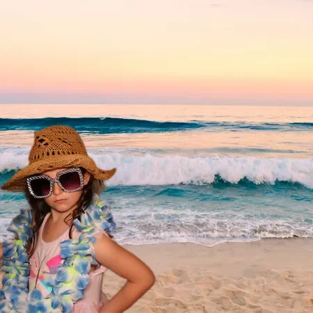 A young girl wearing a straw hat, sunglasses, and a floral lei posing on the beach with ocean waves and a pastel-colored sky in the background.