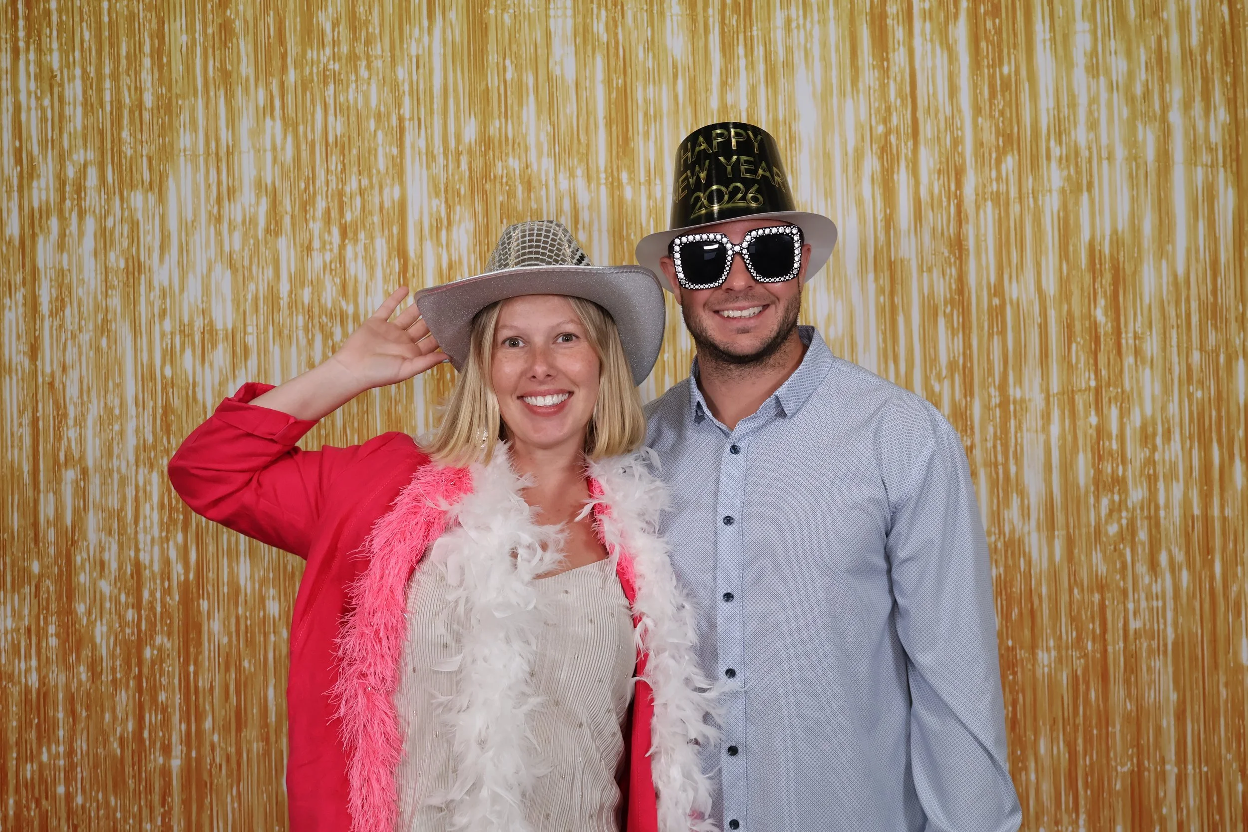 Fun photo booth rental in Sarasota with gold backdrop