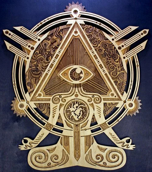 A wooden clock with symbols and geometric designs, featuring an eye within a triangle and an eye at the top, surrounded by intricate patterns and a circular frame.