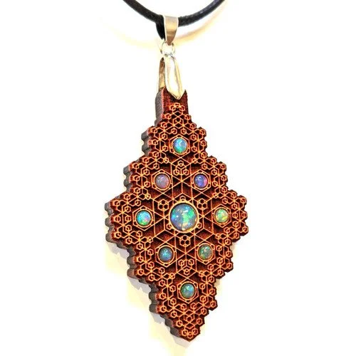 Ornate pendant with a geometric lattice design and colorful gemstones, hanging from a black cord.