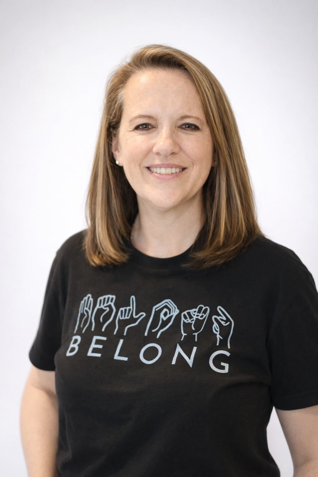 A woman wearing an ASL shirt.png