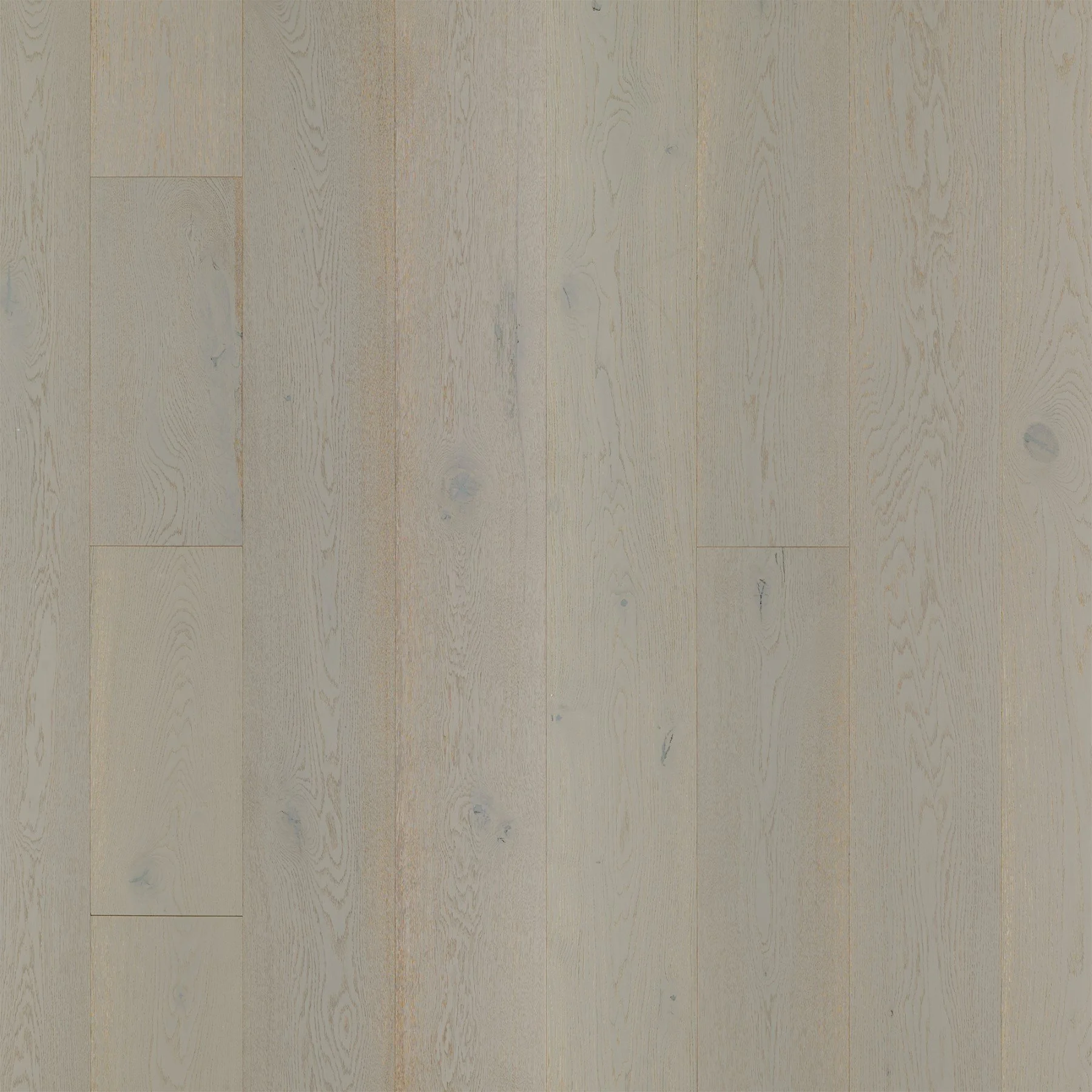 Superficie de piso de madera clara con vetas y nudos visibles.