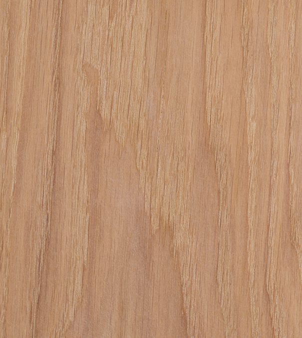 Superficie de madera clara con vetas visibles.